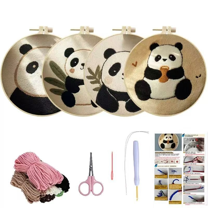 Set of embroidery hoops with panda designs, yarn, scissors, and a needle