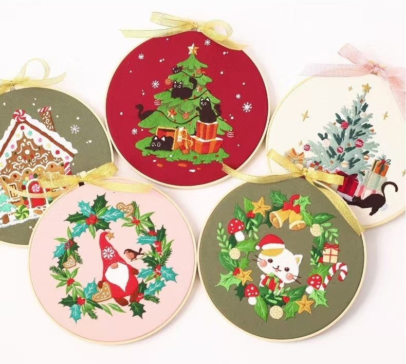 Christmas DIY Hand Embroidery Kit featuring holiday designs, including gingerbread houses, Christmas trees, wreaths, santa and festive kittens