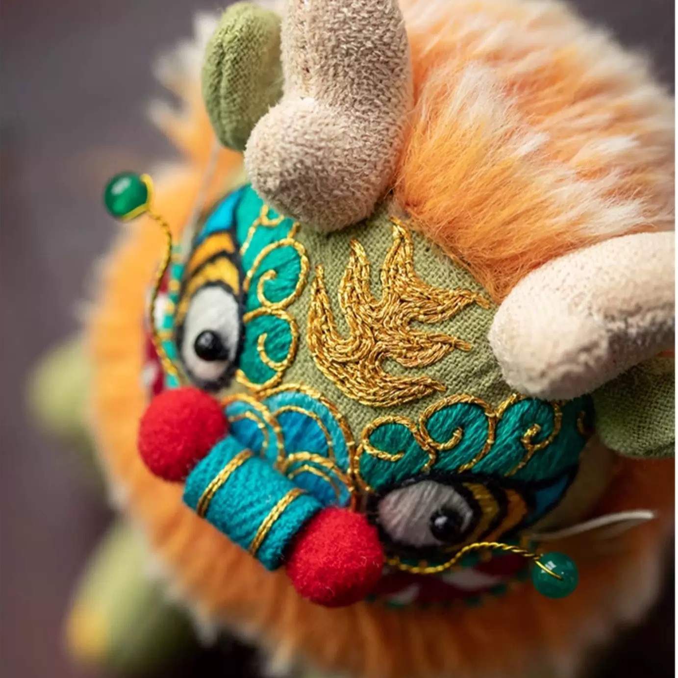Colorful Chinese beast Kylin toy doll with intricate embroidery and vibrant colors