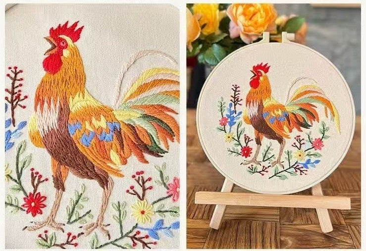 Embroidery hoop with a colorful rooster design on a wooden surface.