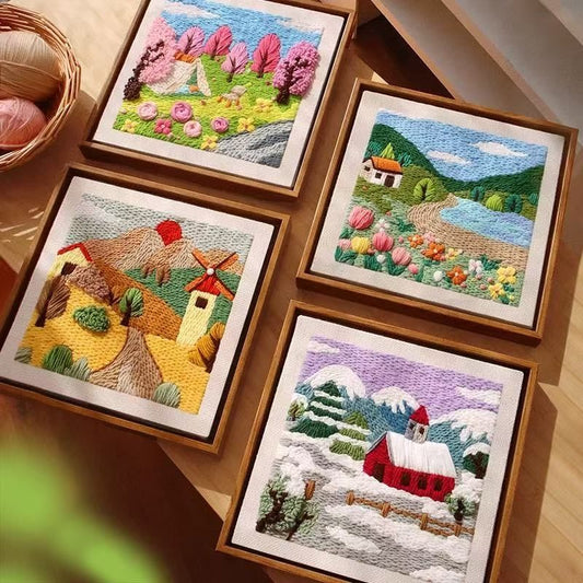 Four punch needle embroidered landscape pictures in wooden frames