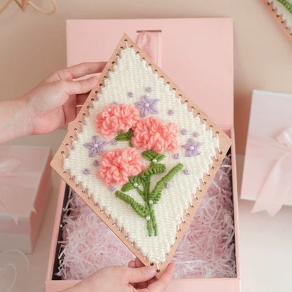 image displaying a finished Carnation Flower Weaving Loom Kit beautifully packed in a gift box