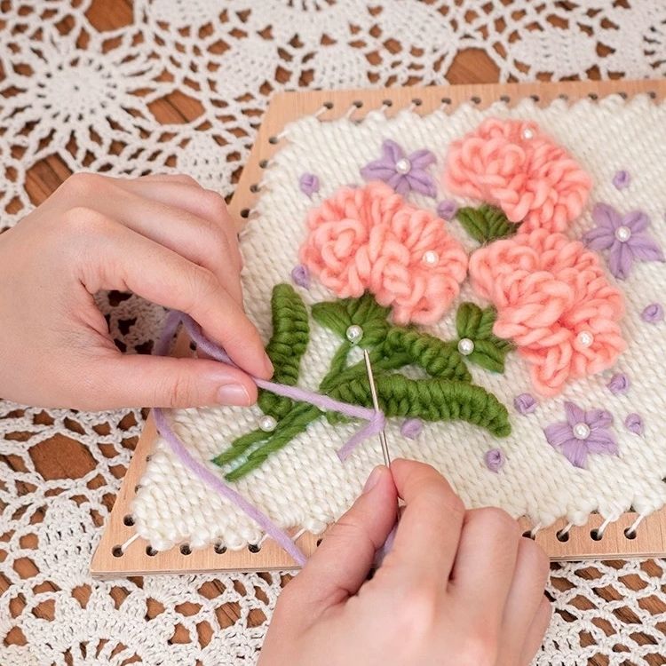 image displaying weaving process of the Carnation Flower Weaving Loom Kit