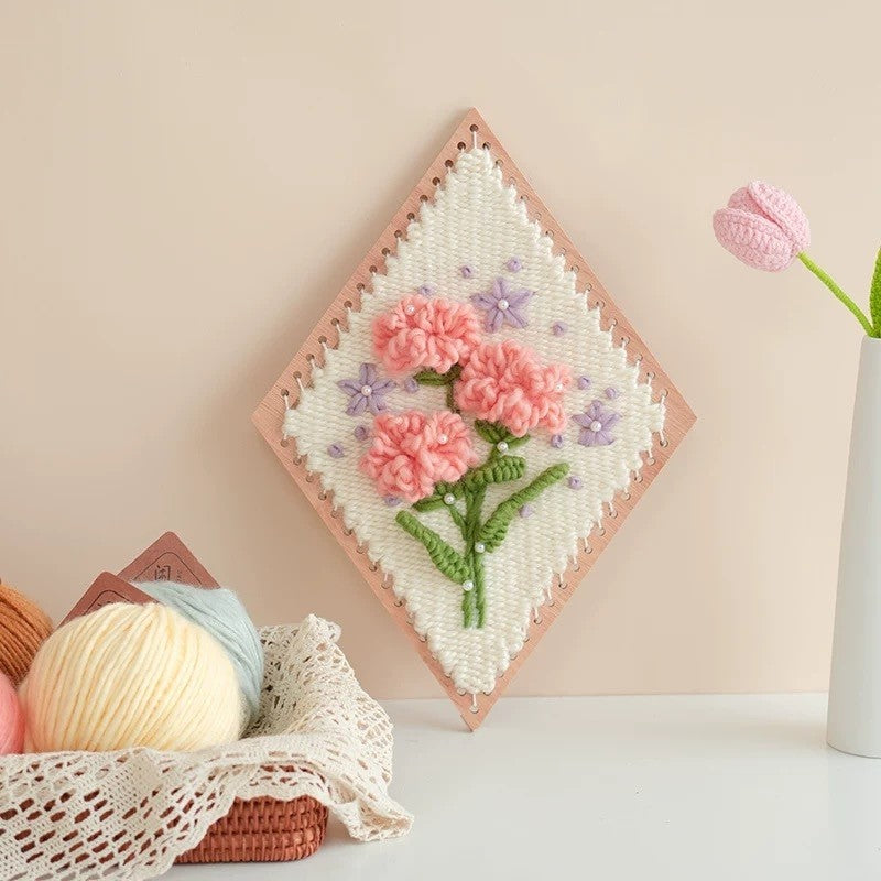 image displaying the finished Carnation Flower Weaving Kit in a table setting to showcase its design