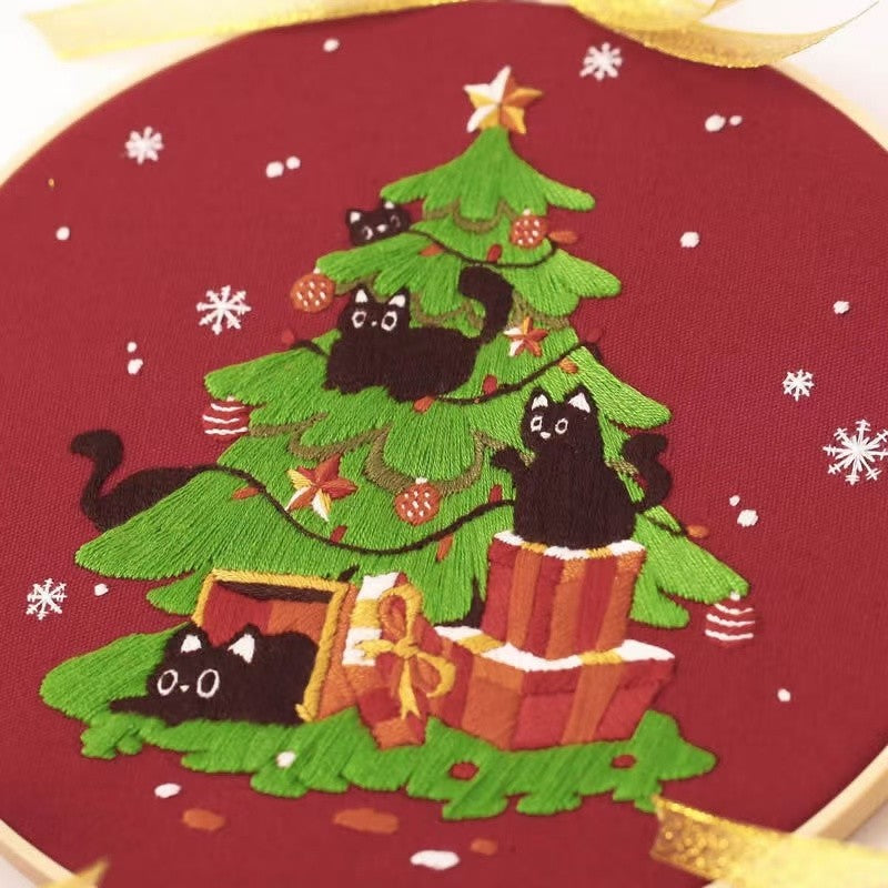 Christmas DIY Hand Embroidery Kit featuring holiday designs, including gingerbread houses, Christmas trees, wreaths, santa and festive kittens