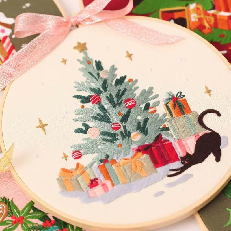 Christmas DIY Hand Embroidery Kit featuring holiday designs, including gingerbread houses, Christmas trees, wreaths, santa and festive kittens