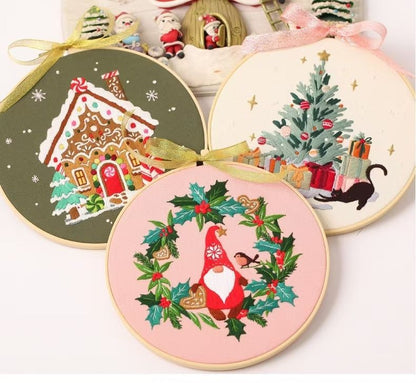 Christmas DIY Hand Embroidery Kit featuring holiday designs, including gingerbread houses, Christmas trees, wreaths, santa and festive kittens