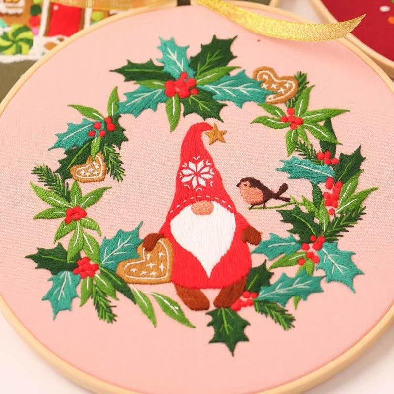 Christmas DIY Hand Embroidery Kit featuring holiday designs, including gingerbread houses, Christmas trees, wreaths, santa and festive kittens