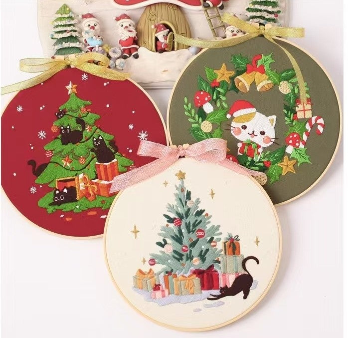 Christmas DIY Hand Embroidery Kit featuring holiday designs, including gingerbread houses, Christmas trees, wreaths, santa and festive kittens