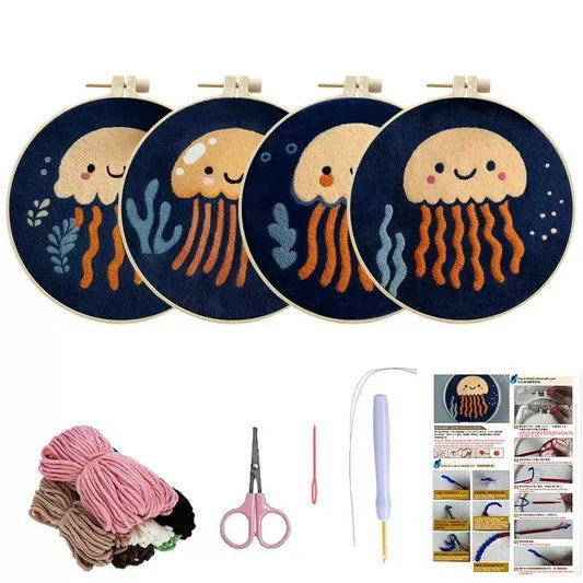 Punch Needle Embroidery hoops with jellyfish designs, yarn, scissors, floss, and instructions