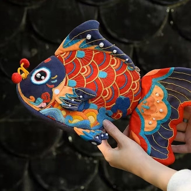 image of the finished Koi Fish Bag Hand Embroidery Kit holding with hands