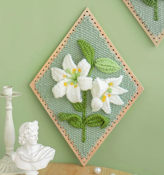 image displaying a finished Lily Flower Weaving Loom Kit against the wall