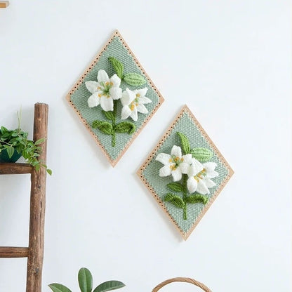 image displaying two finished Lily Flower Weaving Loom Kit hanging on the wall as home decoration