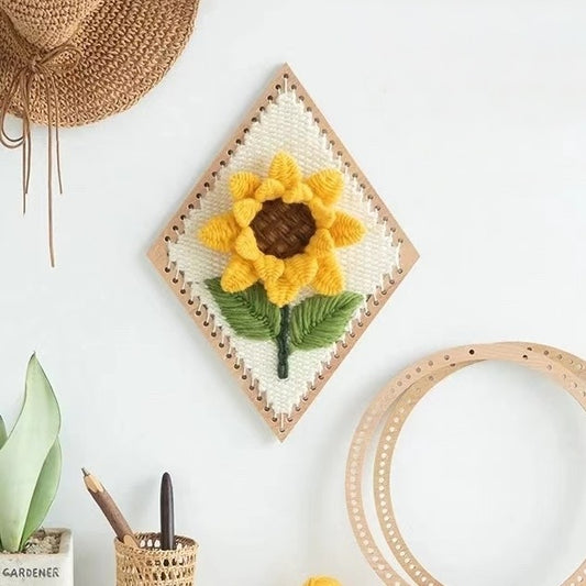 image displaying the finished Sunflower Weaving Loom Kit hanging on the wall as decoration