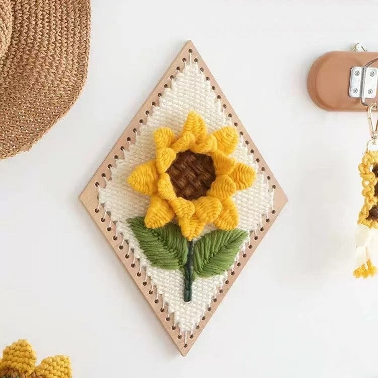 image displaying the finished Sunflower Weaving Loom Kit hanging on the wall as decoration