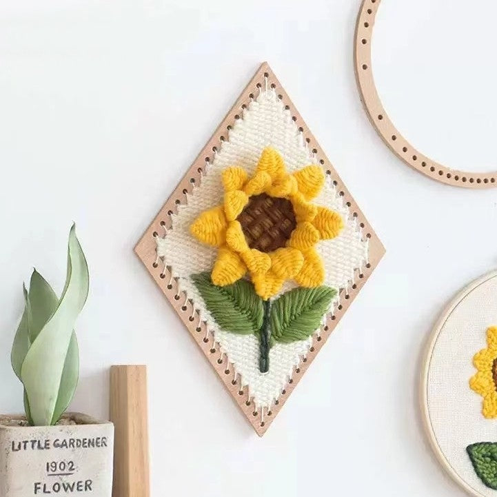 image displaying the finished Sunflower Weaving Loom Kit hanging on the wall as decoration