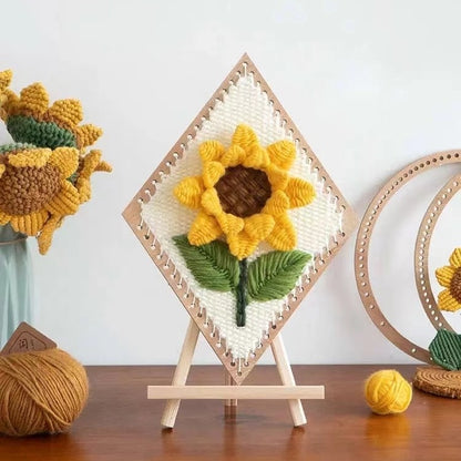 image displaying the finished Sunflower Weaving Loom Kit placed on a wooden stand